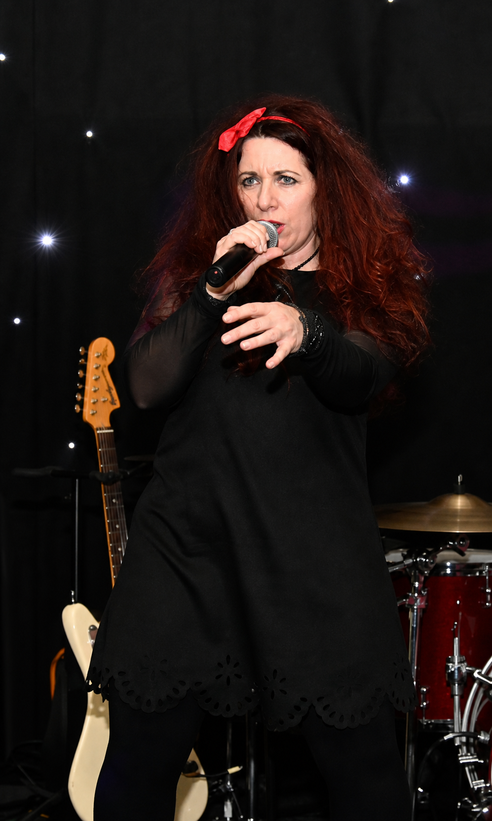 Cleo delivering an energetic live vocal performance with 2HD on stage